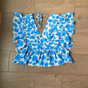 Never worn! Ties in the back.